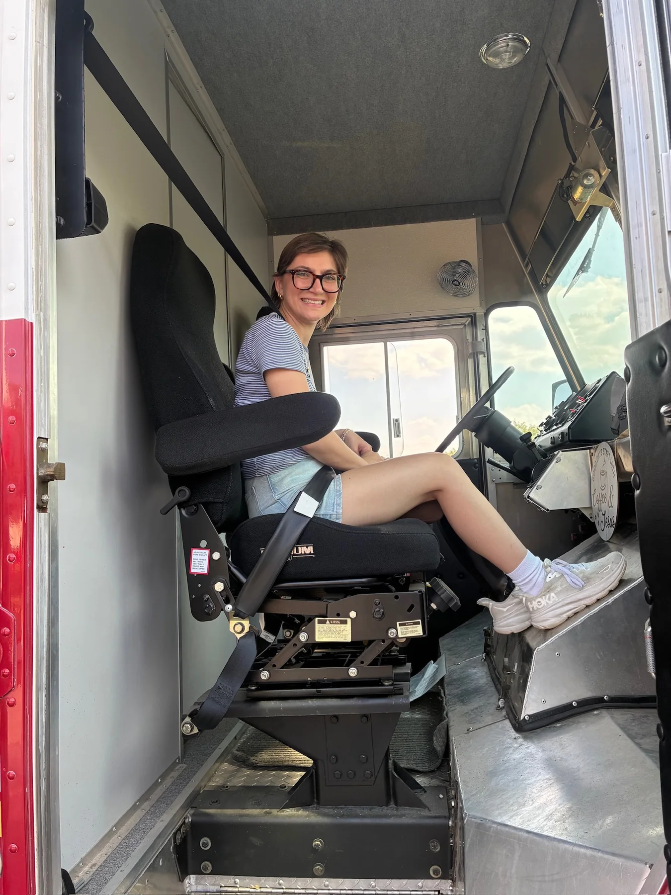 Olivia seated in the truck during an earlier stage of the project